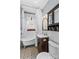 Cozy bathroom featuring a clawfoot tub, patterned tile floor, and classic fixtures at 119 Wiley Ave, Salisbury, NC 28144