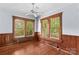 Bedroom with wood floors, wood trim, and two windows at 119 Wiley Ave, Salisbury, NC 28144