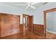 Bedroom with wood floors, wood trim, built in cabinets, and a ceiling fan at 119 Wiley Ave, Salisbury, NC 28144