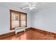 Bedroom with hardwood floors, window, and baseboard trim at 119 Wiley Ave, Salisbury, NC 28144