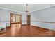 Bright dining room features hardwood floors, a chandelier, and seamless flow into an adjacent room, ideal for entertaining at 119 Wiley Ave, Salisbury, NC 28144