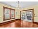 Charming dining room with hardwood floors, large windows, and an open view into the bright, updated kitchen at 119 Wiley Ave, Salisbury, NC 28144