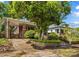 Charming brick home exterior with a stone-lined landscaped yard and a driveway at 119 Wiley Ave, Salisbury, NC 28144