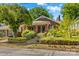 Charming brick home featuring a landscaped front yard with stone accents and a inviting front porch at 119 Wiley Ave, Salisbury, NC 28144