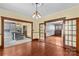 Spacious living room featuring hardwood floors, french doors and view of the kitchen at 119 Wiley Ave, Salisbury, NC 28144
