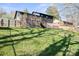 Large backyard with a wooden deck, perfect for entertaining and relaxation at 1628 Starbrook Dr, Charlotte, NC 28210