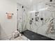 Modern bathroom features frameless glass shower with black fixtures, tiled walls, and a sleek black shower base at 1628 Starbrook Dr, Charlotte, NC 28210