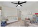 Bright bedroom featuring a crib, cozy chair, and soft carpet, providing a comfortable and inviting space at 1628 Starbrook Dr, Charlotte, NC 28210