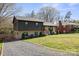 Lovely two-story home featuring a modern exterior and a green, grassy lawn at 1628 Starbrook Dr, Charlotte, NC 28210