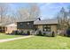 Charming two-story home with a well-manicured lawn and inviting walkway at 1628 Starbrook Dr, Charlotte, NC 28210