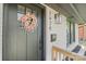 Close-up of the front door, showcasing the charming floral wreath and modern house number at 1628 Starbrook Dr, Charlotte, NC 28210