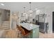 Modern kitchen with green cabinets, a spacious island, and stainless steel appliances at 1628 Starbrook Dr, Charlotte, NC 28210