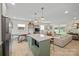 Open-concept kitchen with an island, modern appliances, and seamless transition to the living area at 1628 Starbrook Dr, Charlotte, NC 28210