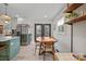 Bright kitchen and dining area with stainless steel appliances, a kitchen island, and a walk out deck at 1628 Starbrook Dr, Charlotte, NC 28210