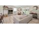 Bright living room featuring stylish furnishings, a large window, and decorative shelving for a cozy ambiance at 1628 Starbrook Dr, Charlotte, NC 28210