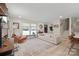 Spacious living room with a large window, a cozy sofa, an area rug, and hardwood floors at 1628 Starbrook Dr, Charlotte, NC 28210