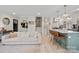 Bright living room featuring a comfortable sofa that transitions seamlessly to the modern kitchen at 1628 Starbrook Dr, Charlotte, NC 28210