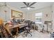Stylish home office with ample guitars, natural light, and a sophisticated herringbone wood floor pattern at 1628 Starbrook Dr, Charlotte, NC 28210