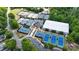 Aerial view of multiple tennis courts with lush green trees and well-maintained surroundings at 18730 Floyd Ct, Davidson, NC 28036