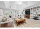 Finished basement with large sectional sofa, built-in bookshelves, and recessed lighting at 18730 Floyd Ct, Davidson, NC 28036