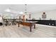 Basement featuring a pool table, bar, and decor with lighting and mirrors at 18730 Floyd Ct, Davidson, NC 28036