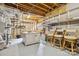 Unfinished basement space with exposed ceilings and potential for customization at 18730 Floyd Ct, Davidson, NC 28036