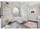 Luxury bathroom with freestanding tub, stone tile shower, and stylish fixtures at 18730 Floyd Ct, Davidson, NC 28036