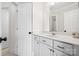 Bathroom with a vanity, a sink, and a door leading to another room at 18730 Floyd Ct, Davidson, NC 28036