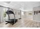 Bright exercise room with a treadmill and large windows with natural light at 18730 Floyd Ct, Davidson, NC 28036