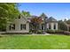 Beautiful home featuring manicured lawn, stone accents, and a welcoming front entrance under clear skies at 18730 Floyd Ct, Davidson, NC 28036
