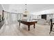 Spacious game room featuring a pool table, recessed lights, and bright windows at 18730 Floyd Ct, Davidson, NC 28036