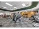 Bright gym with wood accent wall featuring cardio and weight training equipment at 18730 Floyd Ct, Davidson, NC 28036