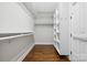 Spacious walk-in closet with shelving, hanging rods, and ample storage space for clothing and accessories at 18730 Floyd Ct, Davidson, NC 28036