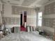 Bedroom featuring an open layout with large window and doorway to an attached bath at 19028 Newburg Hill Rd, Davidson, NC 28036