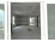 Bright, open-concept living room with sliding glass doors leading to the outdoor space at 19028 Newburg Hill Rd, Davidson, NC 28036
