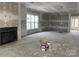Spacious living room featuring a fireplace, and a large window allowing ample light at 19028 Newburg Hill Rd, Davidson, NC 28036