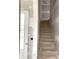 Staircase leading to the upper level, alongside an entry door, allows for easy access at 19028 Newburg Hill Rd, Davidson, NC 28036