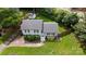 Aerial view of a well-maintained home featuring lush landscaping, fenced backyard, and a pristine lawn at 2100 Shadyview Dr, Charlotte, NC 28210