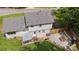 Aerial view of a backyard featuring a patio area, grill, fenced yard, and lush green lawn at 2100 Shadyview Dr, Charlotte, NC 28210