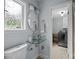 Bathroom featuring a modern, glass bowl sink and a view of the laundry room with appliances at 2100 Shadyview Dr, Charlotte, NC 28210