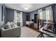 Comfortable room with a sofa, desk and shelving offering a tranquil workspace at 2100 Shadyview Dr, Charlotte, NC 28210