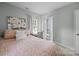 Bedroom featuring en suite bathroom creating a seamless flow between the sleeping and grooming spaces at 2100 Shadyview Dr, Charlotte, NC 28210