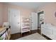 Charming bedroom with hardwood floors and a display shelf, creating a delightful atmosphere at 2100 Shadyview Dr, Charlotte, NC 28210