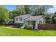 Charming two-story home with a well-manicured lawn, fresh landscaping, and classic architecture at 2100 Shadyview Dr, Charlotte, NC 28210