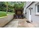 View of outdoor bar with seating and a brick retaining wall providing privacy and definition at 2100 Shadyview Dr, Charlotte, NC 28210