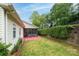 Backyard features a screened patio and lush greenery, ideal for outdoor relaxation and entertaining in a private setting at 2478 23Rd Ne St, Hickory, NC 28601