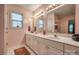 Bathroom featuring double sinks and white cabinets offering substantial storage at 2478 23Rd Ne St, Hickory, NC 28601