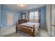 Bedroom featuring floral bedspread and wood furniture plus neutral carpet at 2478 23Rd Ne St, Hickory, NC 28601
