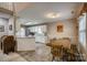 Bright dining area with hardwood floors, wooden table, and natural light at 2478 23Rd Ne St, Hickory, NC 28601