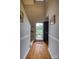 Inviting foyer boasts hardwood floors, decorative trim, and a view of the front yard through the glass-paneled front door at 2478 23Rd Ne St, Hickory, NC 28601